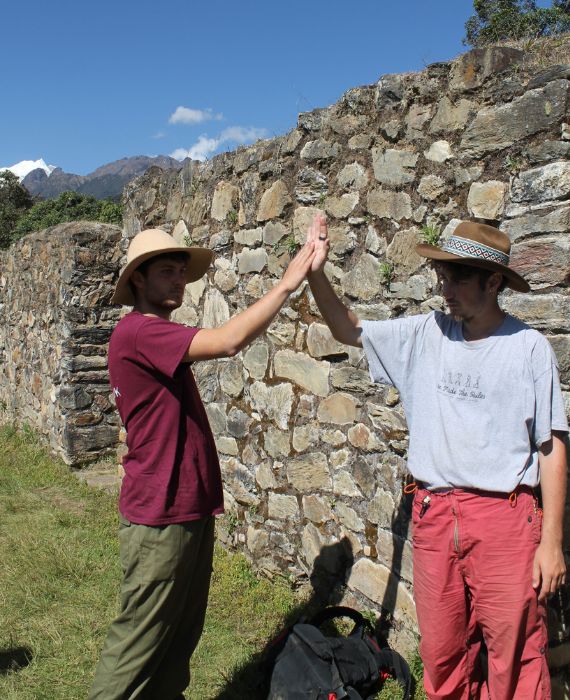 Two people high fiving for helping the community in Peru - Challenges Abroad