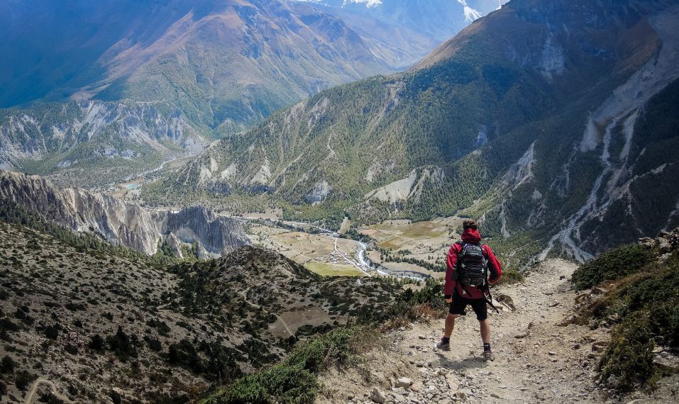 Man hiking in Nepal looking out at the mountains- Challenges Abroad