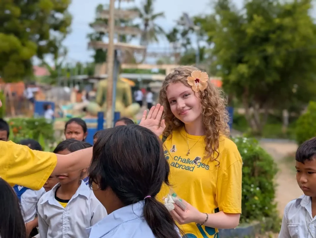 Challenges Abroad participant waving at camera